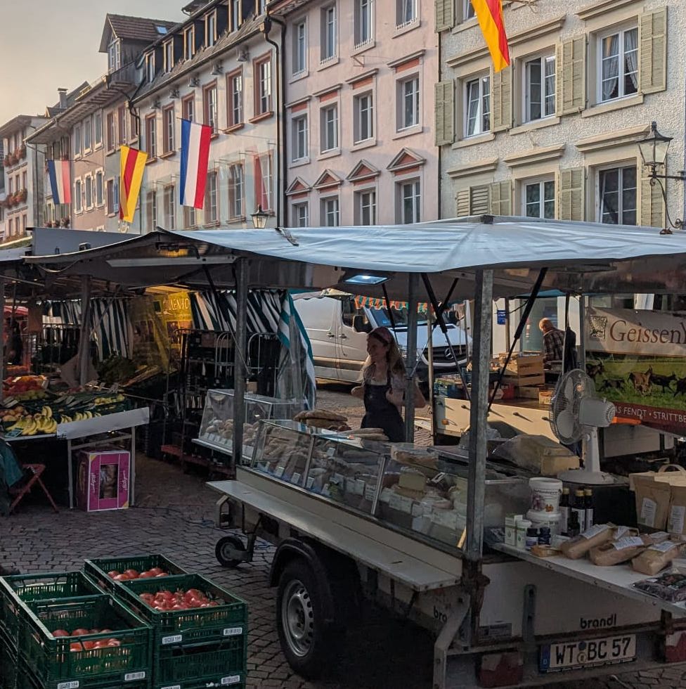 An early morning of our market stand, tomatoes and me!