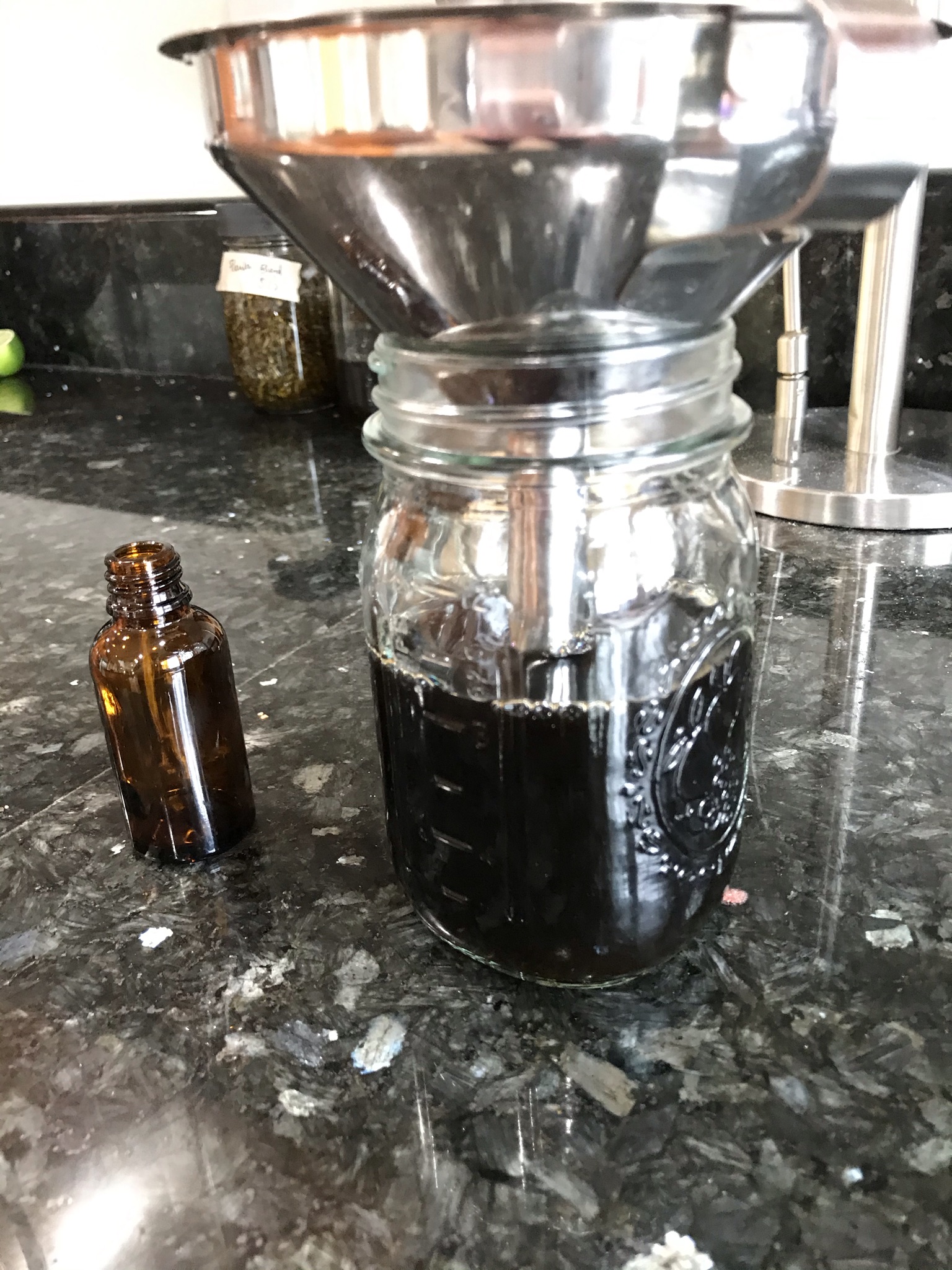Straining herbal extract for bottling
