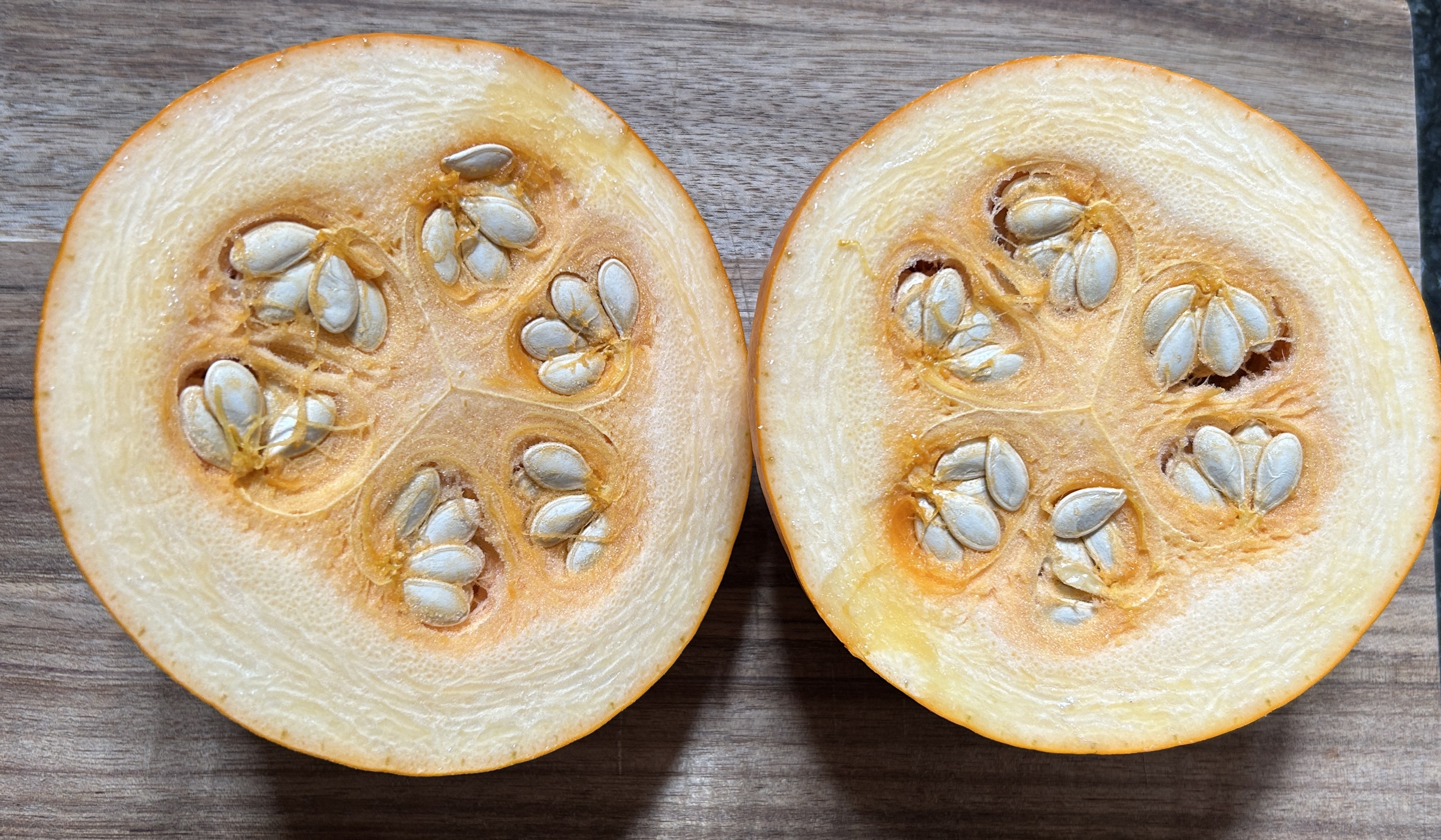 the inside of a halfed pumpkin 