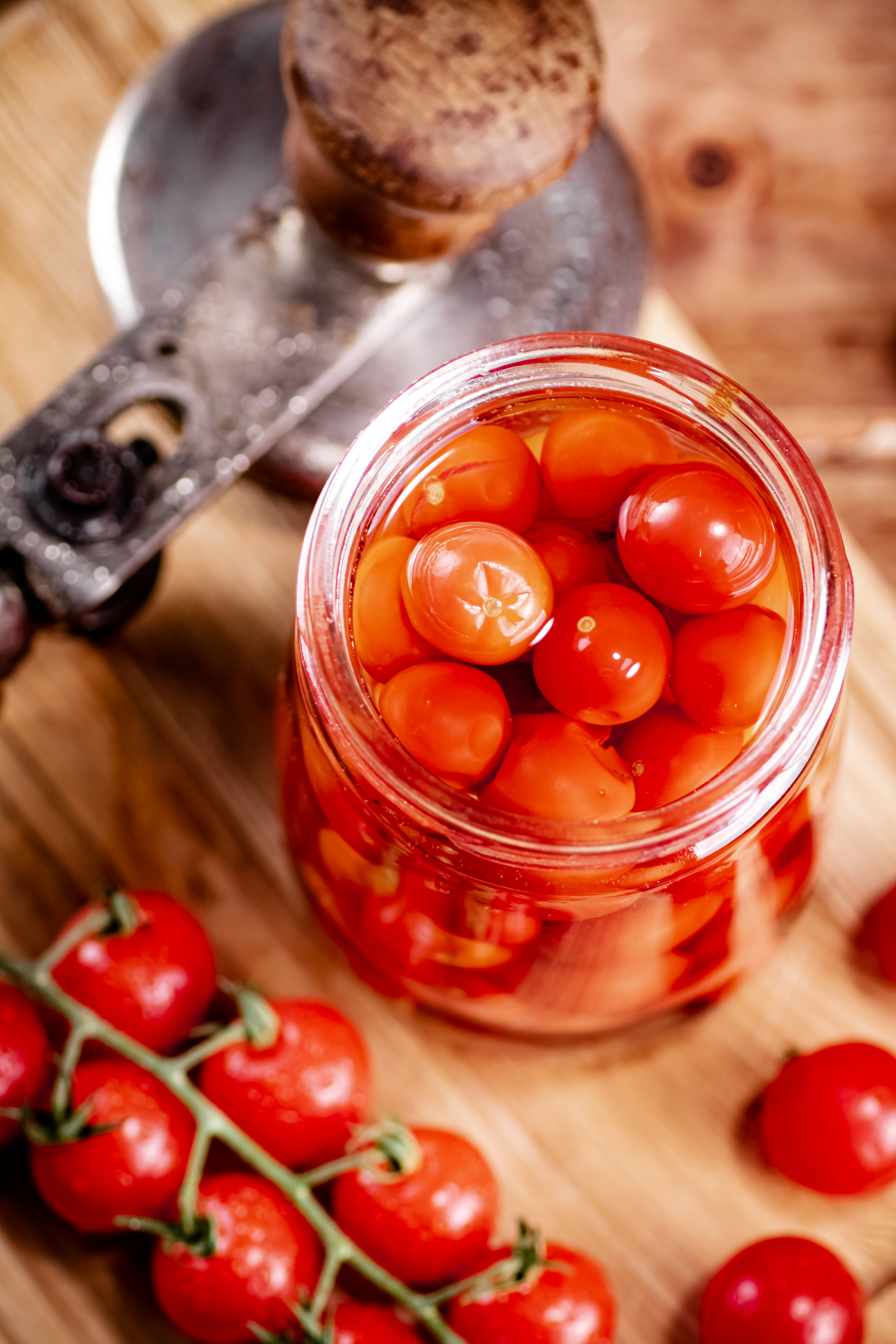 Glass jar with pickled tomatoes in a brine 